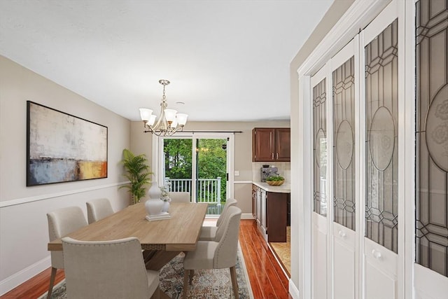 24 Highcrest Park Unit 24, Webster, MA 01570 - dining room with wood finished floors, a chandelier, and baseboards
