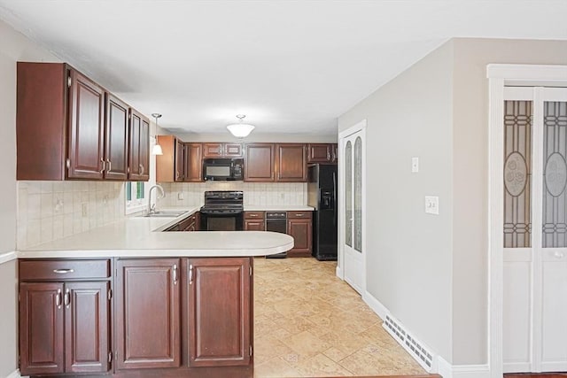 24 Highcrest Park Unit 24, Webster, MA 01570 - kitchen featuring black appliances, a sink, decorative backsplash, light countertops, and a peninsula