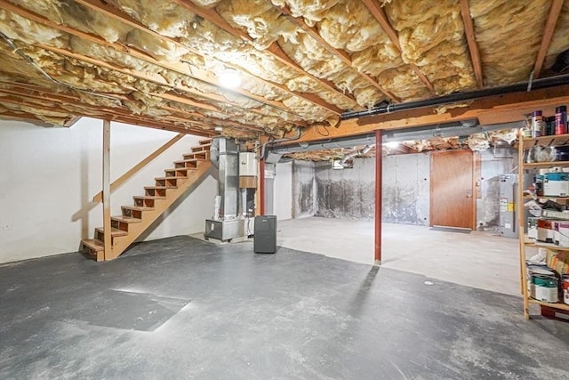 24 Highcrest Park Unit 24, Webster, MA 01570 - unfinished basement featuring stairs, heating unit, and water heater