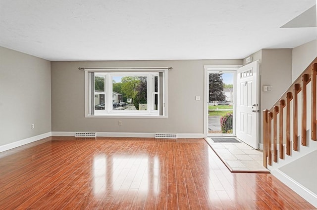 24 Highcrest Park Unit 24, Webster, MA 01570 - entrance foyer featuring wood finished floors, baseboards, and stairway