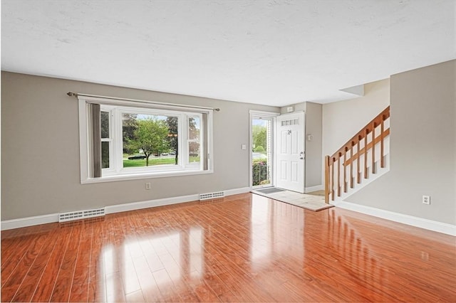 24 Highcrest Park Unit 24, Webster, MA 01570 - entryway featuring baseboards, wood finished floors, and stairway