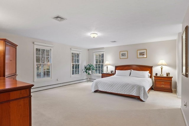 carpeted bedroom featuring a baseboard radiator