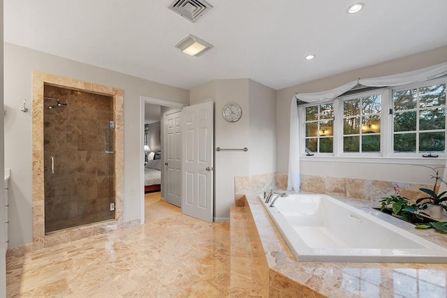 bathroom featuring independent shower and bath