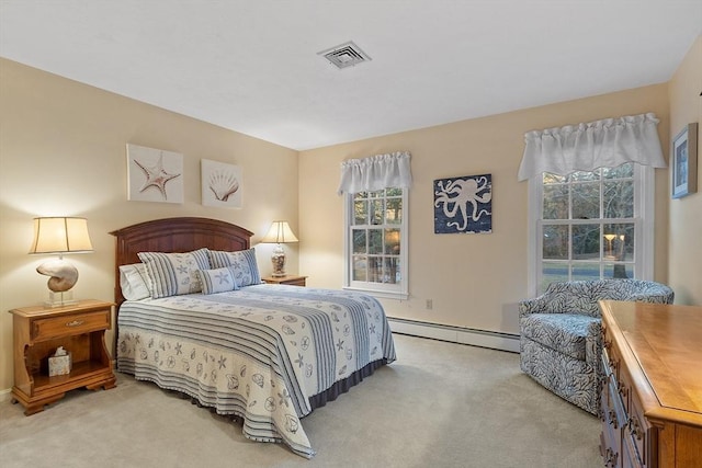 bedroom with a baseboard radiator and light carpet