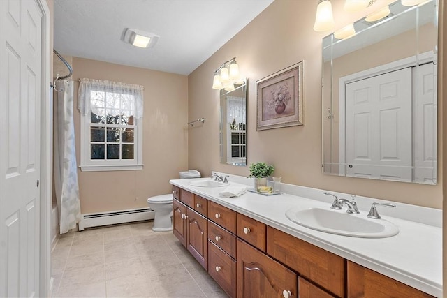 bathroom with a shower with curtain, a baseboard radiator, vanity, and toilet