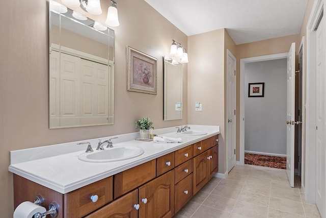 bathroom with tile patterned floors and vanity