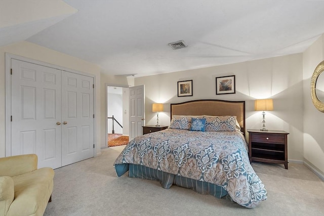 carpeted bedroom with a closet