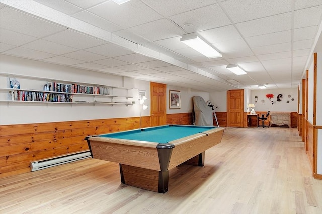 recreation room with wooden walls, billiards, light hardwood / wood-style flooring, a paneled ceiling, and baseboard heating