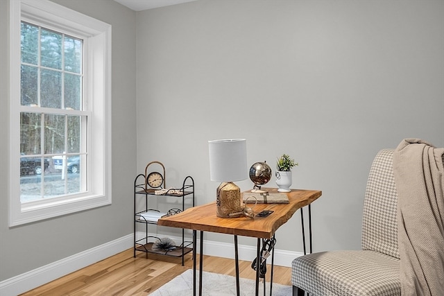 home office with hardwood / wood-style flooring and a wealth of natural light