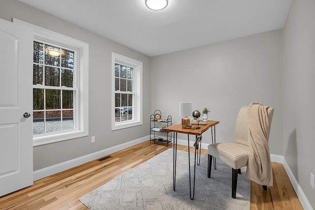 home office with hardwood / wood-style floors