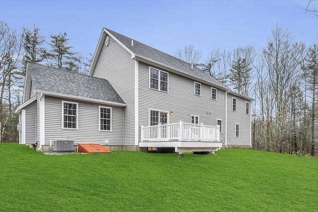 back of house with a yard, a wooden deck, and central AC unit