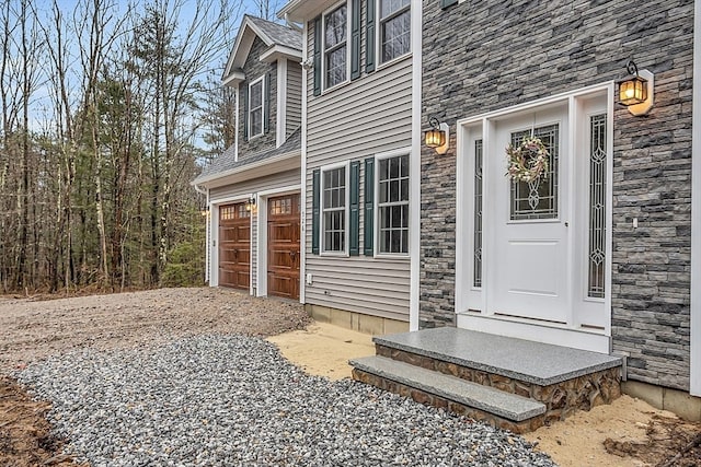 view of exterior entry featuring a garage