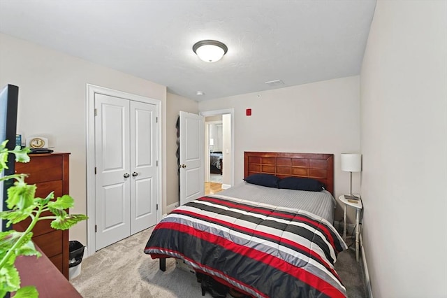 carpeted bedroom featuring a closet