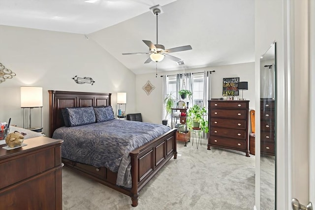 bedroom with light carpet, vaulted ceiling, and ceiling fan