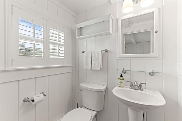 751 Crowell Rd, Chatham, MA 02650 - half bath with toilet, plenty of natural light, tile walls, and a sink