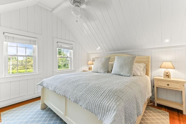 751 Crowell Rd, Chatham, MA 02650 - bedroom with lofted ceiling, wood finished floors, and a decorative wall