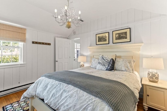 751 Crowell Rd, Chatham, MA 02650 - bedroom with vaulted ceiling, hardwood / wood-style floors, a chandelier, and a baseboard radiator
