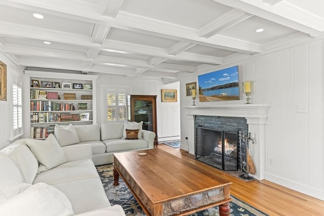 751 Crowell Rd, Chatham, MA 02650 - living area with wood finished floors, a lit fireplace, beamed ceiling, coffered ceiling, and a baseboard radiator