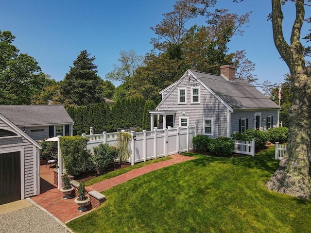 751 Crowell Rd, Chatham, MA 02650 - rear view of property featuring a chimney and a shingled roof