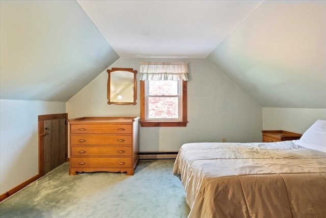 bedroom with a baseboard heating unit, lofted ceiling, and light carpet