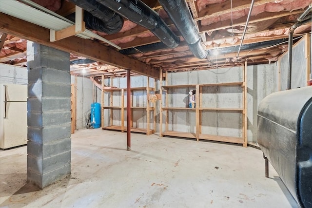 basement featuring white fridge