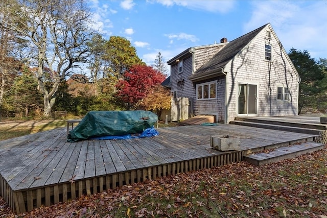 back of property featuring a deck