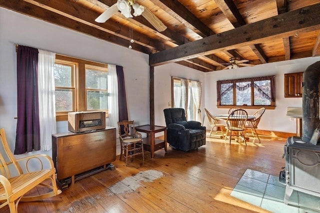 living area featuring a wealth of natural light, light hardwood / wood-style floors, and ceiling fan