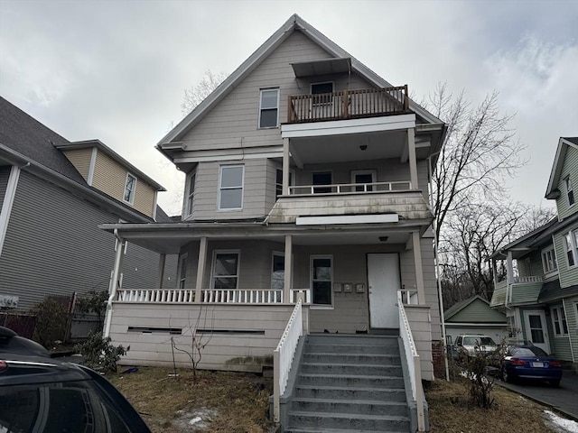 view of front of house with covered porch and a balcony