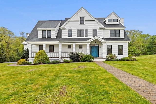 45 Ocean Ledge Dr, Cohasset, MA 02025 - view of front of home featuring covered porch and a front lawn
