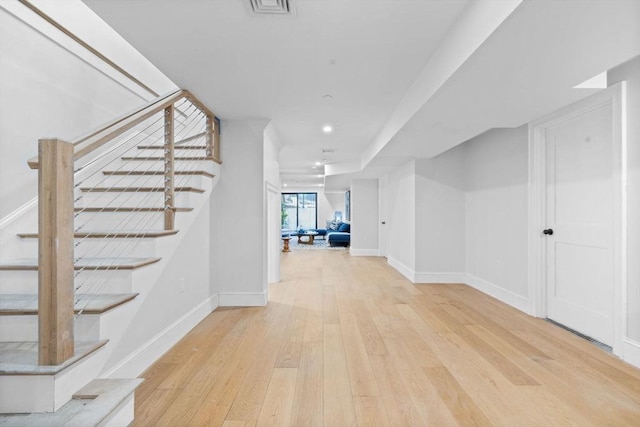 667 Tremont St Unit 1, Boston, MA 02118 - basement featuring stairway, hardwood / wood-style flooring, baseboards, and recessed lighting
