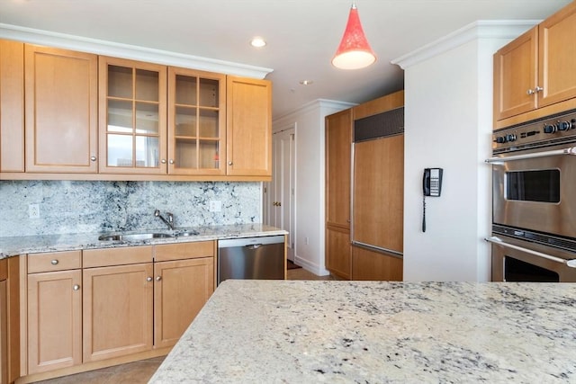 kitchen with a sink, light stone counters, backsplash, stainless steel appliances, and glass insert cabinets