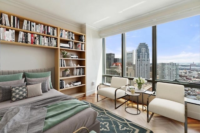 bedroom featuring a city view and ornamental molding