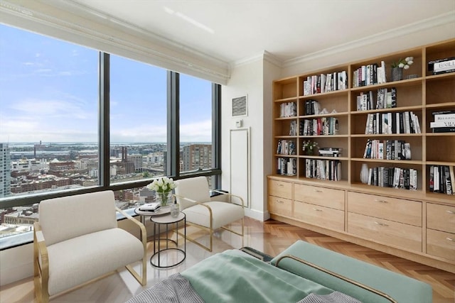 sitting room featuring visible vents and ornamental molding