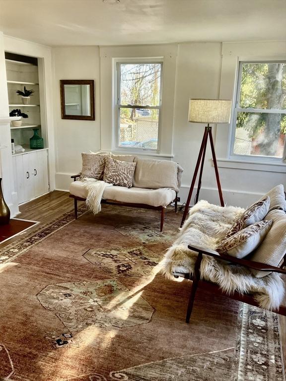 living area with hardwood / wood-style floors