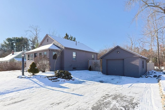 view of front of property with an outdoor structure and a garage