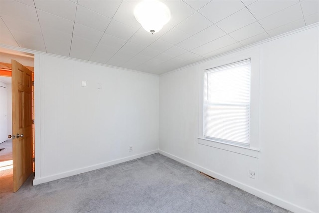 empty room with light colored carpet