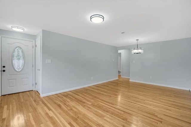 738 Piper Rd, West Springfield, MA 01089 - foyer with light wood finished floors and a chandelier