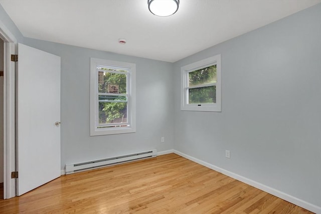 738 Piper Rd, West Springfield, MA 01089 - unfurnished room with a baseboard heating unit, wood finished floors, and a smoke detector