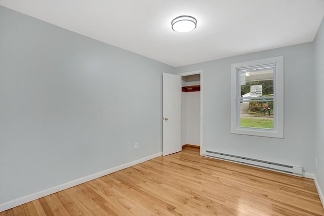 738 Piper Rd, West Springfield, MA 01089 - unfurnished bedroom with baseboard heating, wood finished floors, and a closet