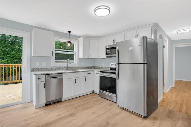738 Piper Rd, West Springfield, MA 01089 - kitchen with appliances with stainless steel finishes, white cabinets, and healthy amount of natural light