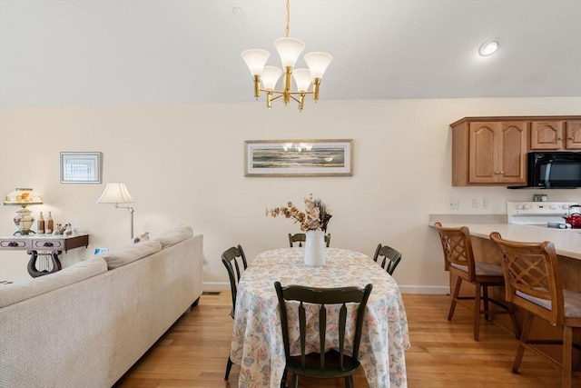 905 Village Ln Unit 905, Bellingham, MA 02019 - dining room featuring a chandelier and light wood-style flooring