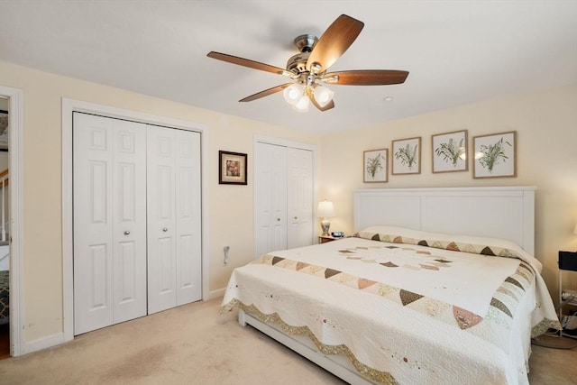 905 Village Ln Unit 905, Bellingham, MA 02019 - bedroom featuring multiple closets, light colored carpet, and a ceiling fan