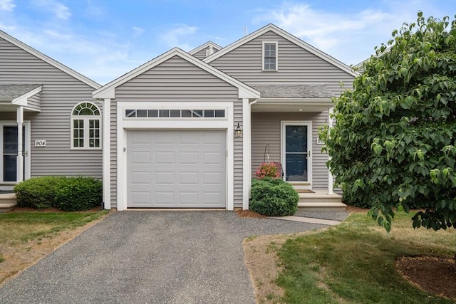 905 Village Ln Unit 905, Bellingham, MA 02019 - view of front of house featuring asphalt driveway and an attached garage