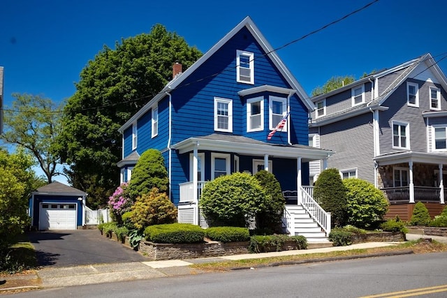 5 Clement Ave, Peabody, MA 01960 - view of front facade with an outbuilding, covered porch, a chimney, driveway, and stairs