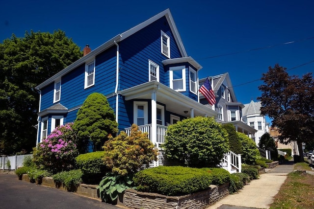 5 Clement Ave, Peabody, MA 01960 - view of property exterior featuring a chimney and covered porch