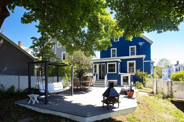 5 Clement Ave, Peabody, MA 01960 - back of property with a wooden deck and entry steps