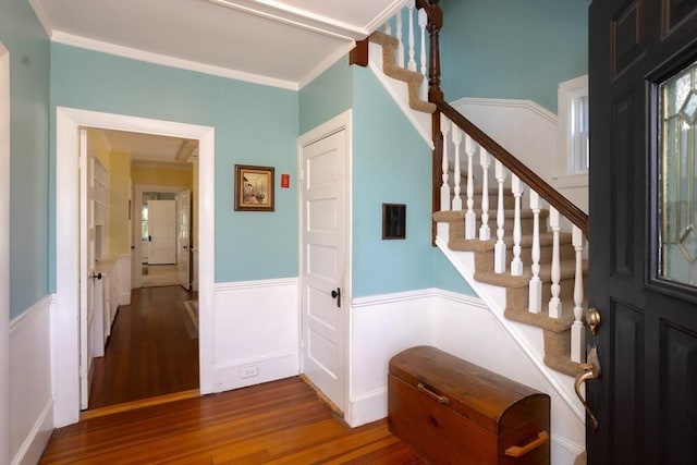 5 Clement Ave, Peabody, MA 01960 - foyer entrance with wood finished floors, a wainscoted wall, crown molding, and stairway