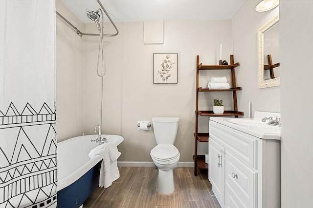 24 Willard St, Malden, MA 02148 - bathroom with a soaking tub, wood finished floors, vanity, and a shower
