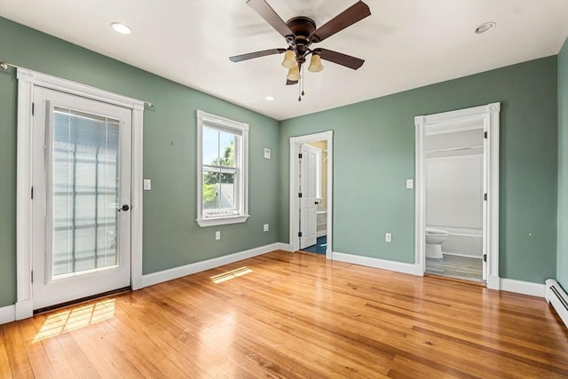 24 Willard St, Malden, MA 02148 - unfurnished bedroom featuring access to outside, light wood-type flooring, ensuite bathroom, a baseboard radiator, and a ceiling fan