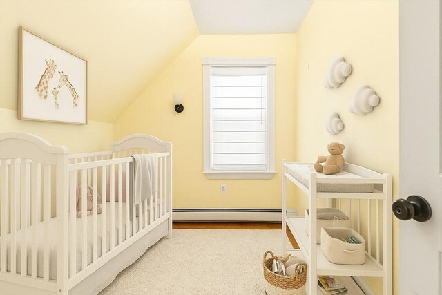 24 Willard St, Malden, MA 02148 - bedroom featuring baseboard heating, a crib, and vaulted ceiling